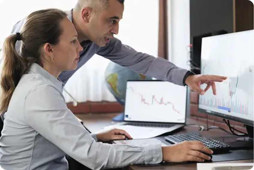 Professionals discussing financial charts